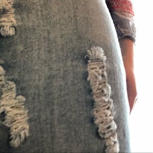 Distressed denim skirt.